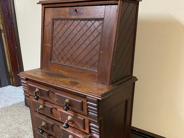 Antique walnut drop-front desk with carved lattice panel, featured item in this auction
