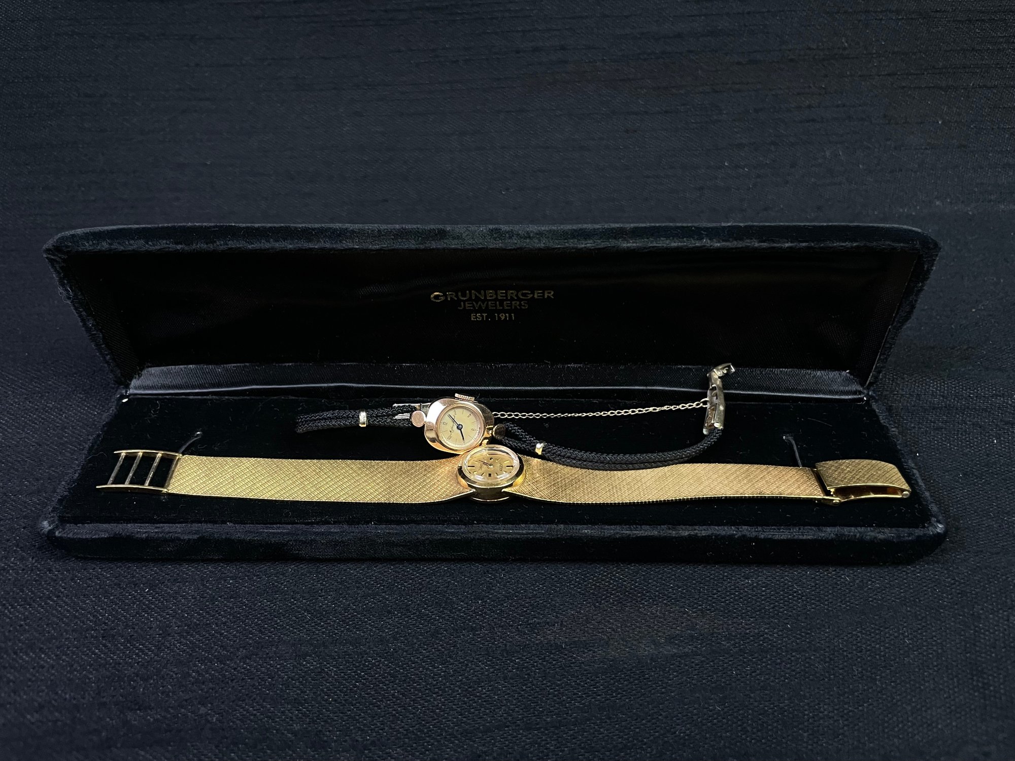 Gold watch in its case