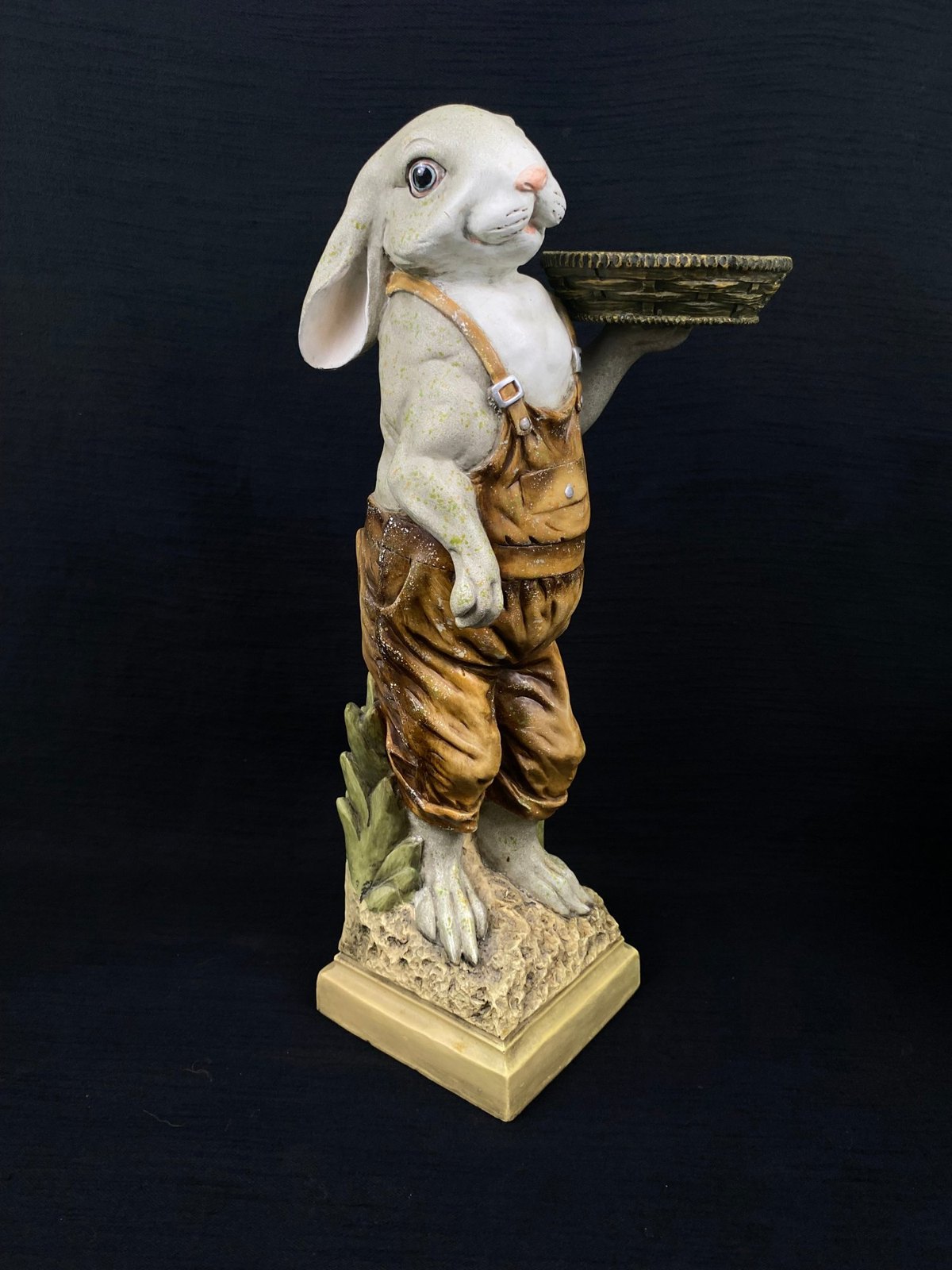 Rabbit figurine holding a tray